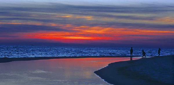 kids on the beach at sunset